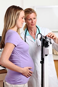 Physician examining young patient at Medcentre Family Clinic