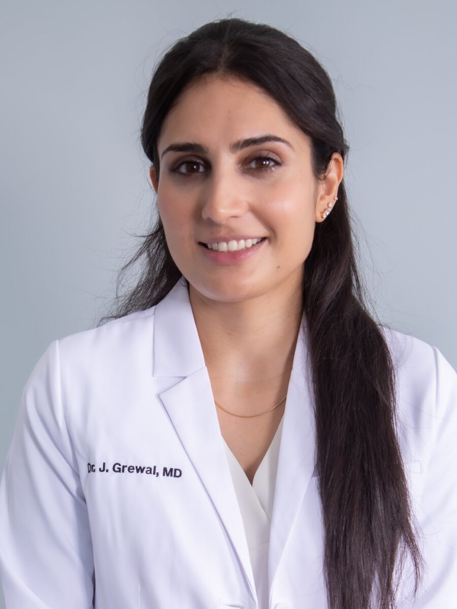 Dr. Jasleen Kaur Grewal, MD, CCFP wearing a lab coat